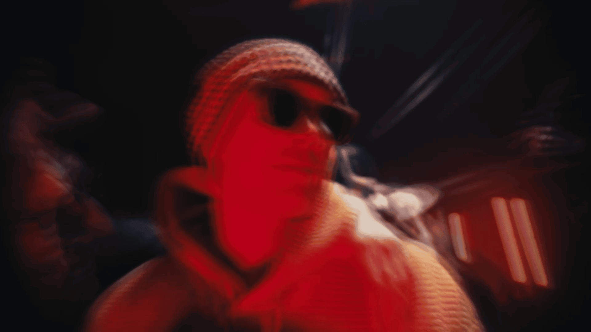 Creative video agency team working on a project with vibrant red lighting.