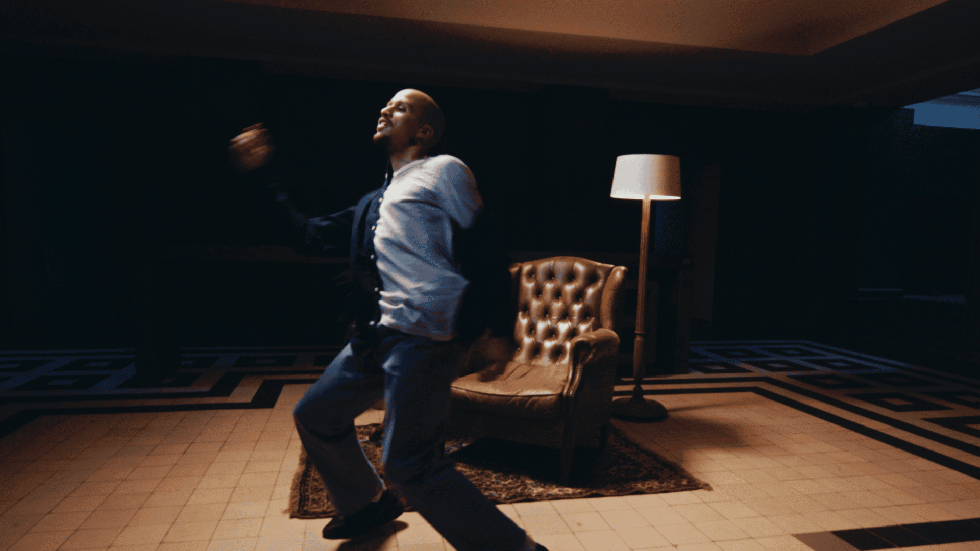 Dynamic dancer performing in a modern studio setting.