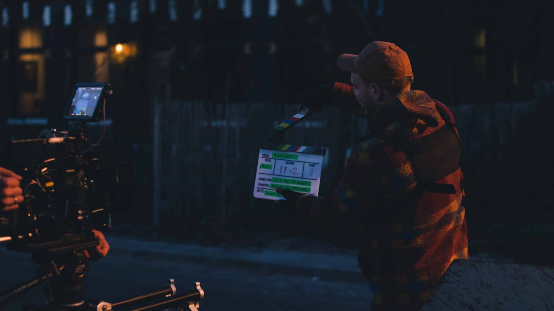 Nighttime video shoot with professional camera and lighting equipment.