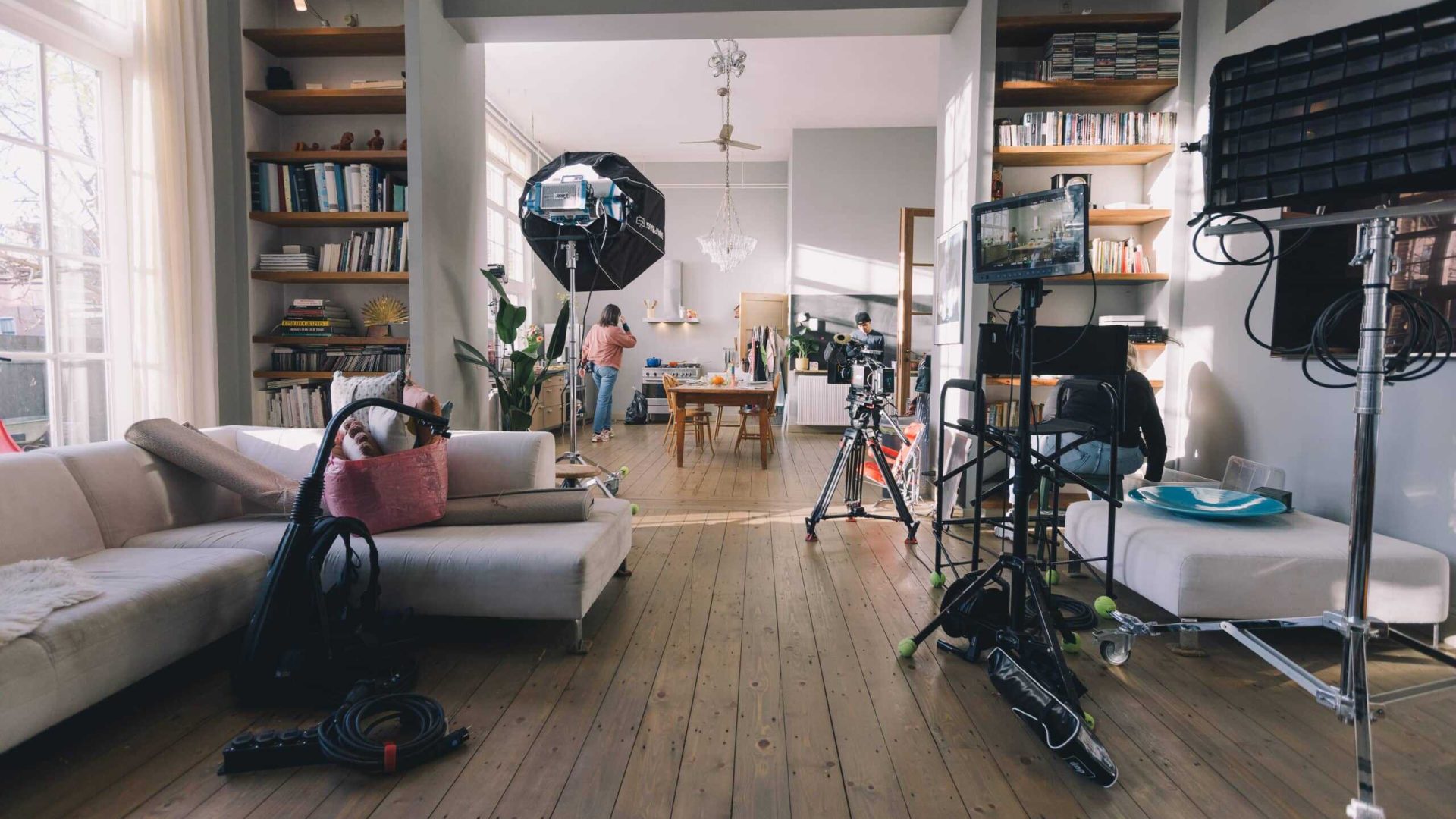 Interior of a professional video studio with lighting, cameras, and equipment for filming.