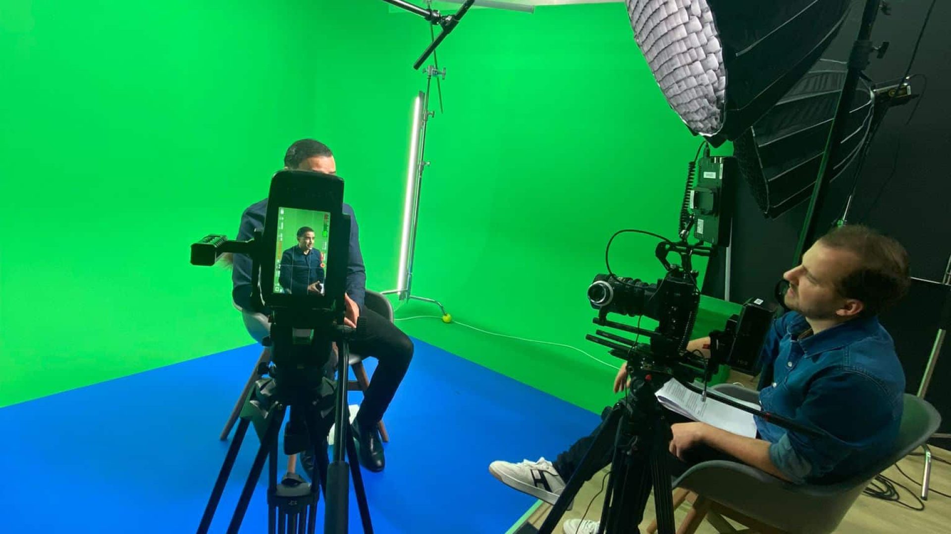 Professional video studio with green screen setup for creative video production.